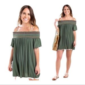 FRANCESCA’S OLIVE GREEN CLAIRE OFF THE SHOULDER SMOCKED POM POM DRESS SZ MEDIUM